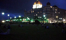 Gateway of India park, Taj Hotel in back, night view.